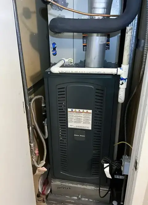 An American Standard air handler installed inside a home.