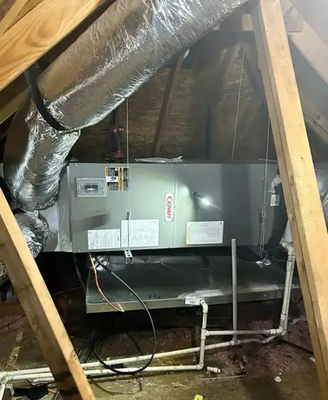 A preventive maintenance job in the attic of a customer's home.