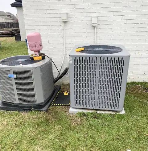 Adding coolant to a customer's HVAC units.