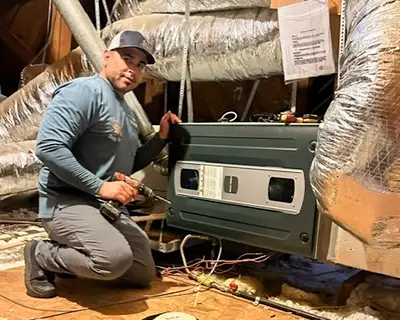 JRAC Cooling & Heating technician installs a mini-split unit for a customer in Dallas.